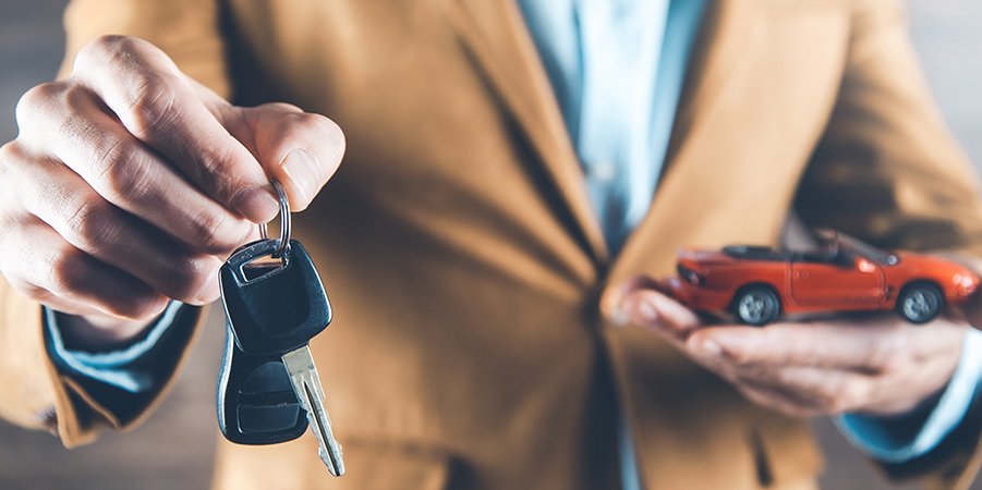 Imagen de Man Hand Car Model With Key On Dark Background