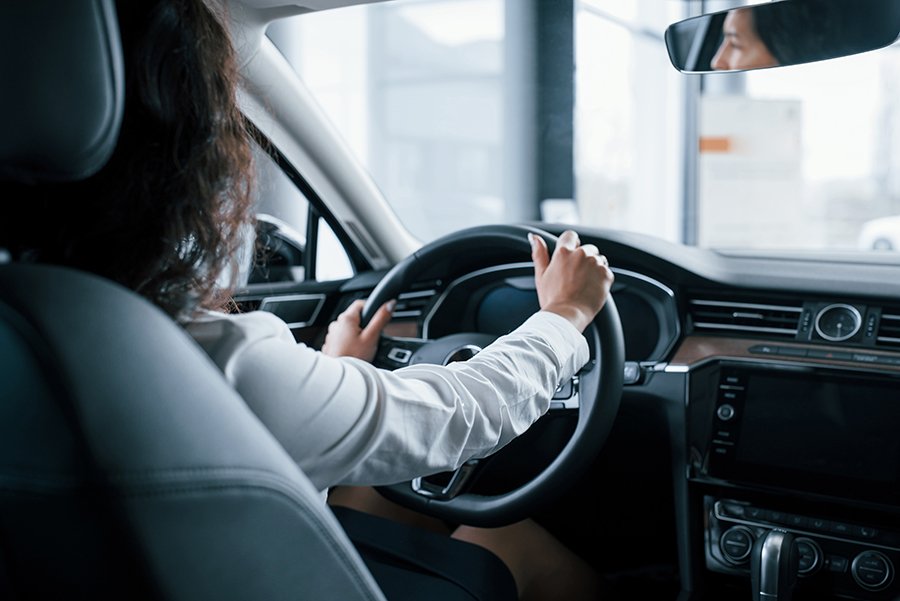Imagen de Hands On Steering Wheel. Beautiful Businesswoman Trying Her New Car In The Automobile Salon